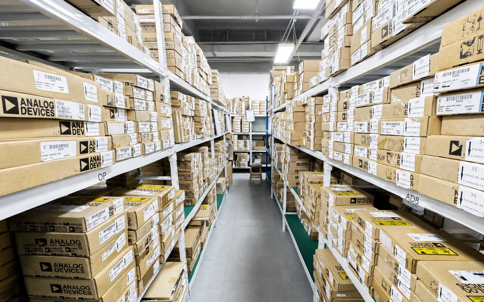 Fully stocked electronic component warehouse aisle