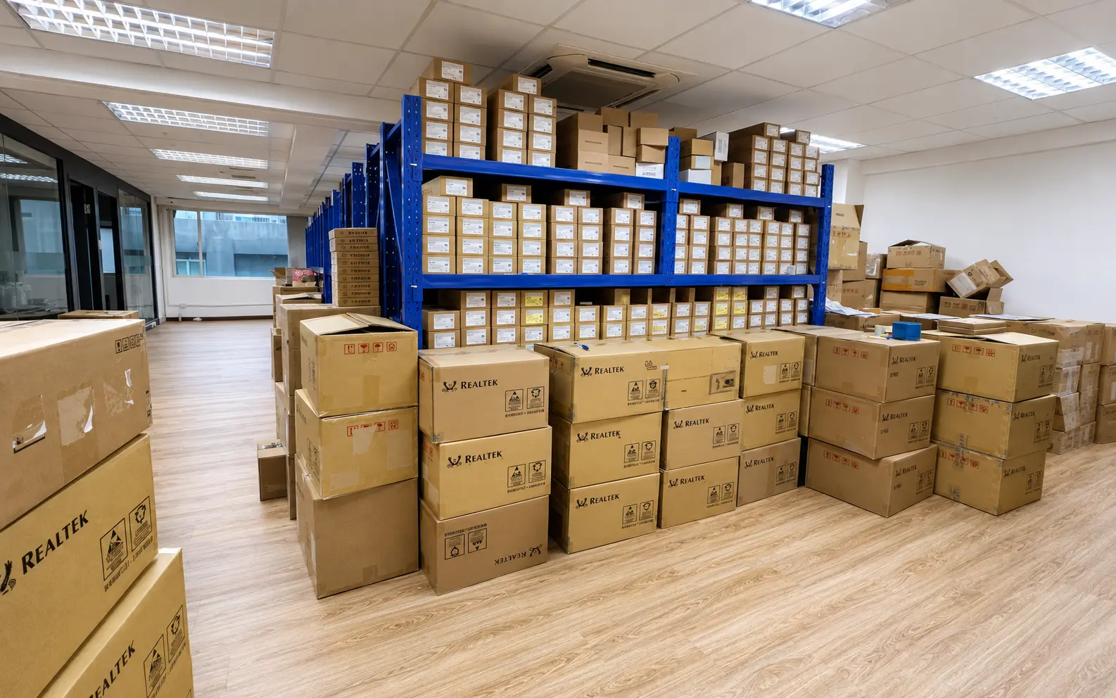 Organized semiconductor warehouse with stocked blue shelving