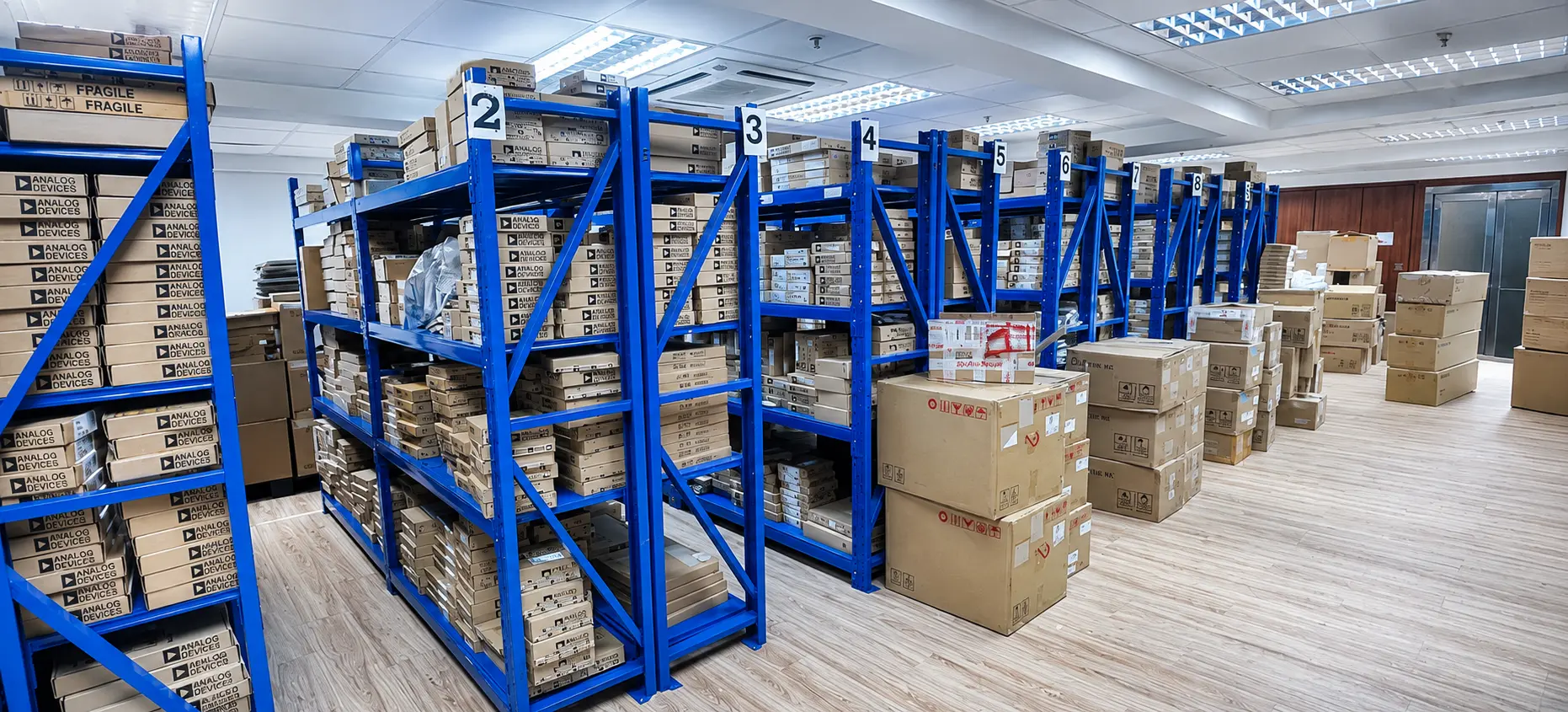 Electronic component inventory arranged across warehouse shelving